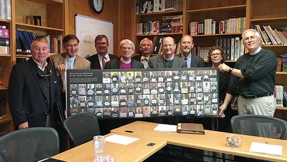 Bishop Lawernce and trustees with banner from clergy