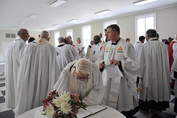 Clergy sign guest book at Salmon memorial service